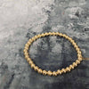 14 karat Guldbelagt armband sammansatt av sirliga pärlor
