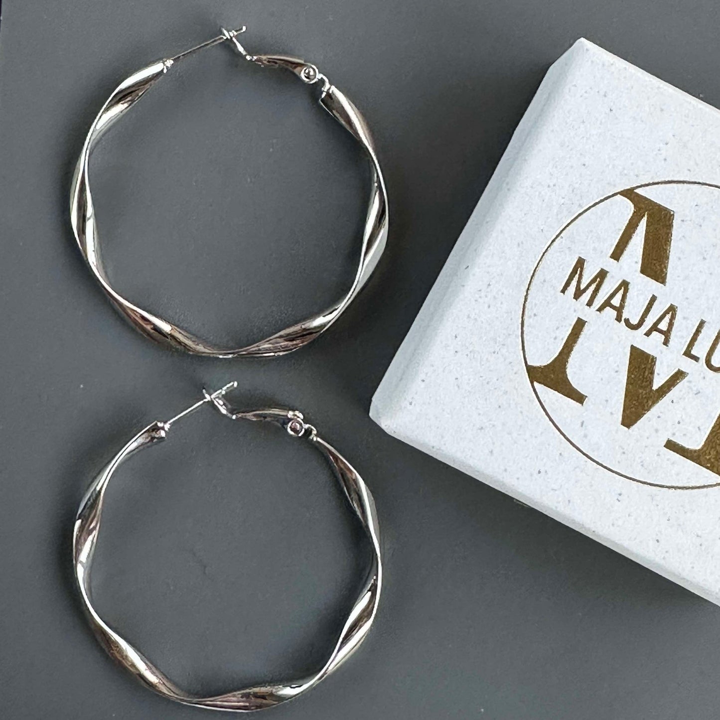 Hopp Twisted Silverbelagda Örhängen