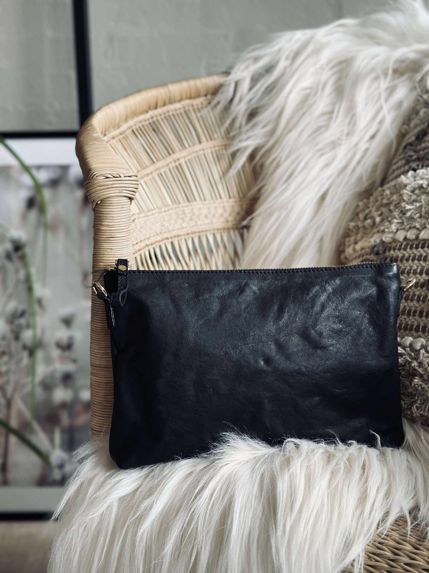 Clutch i svart läder