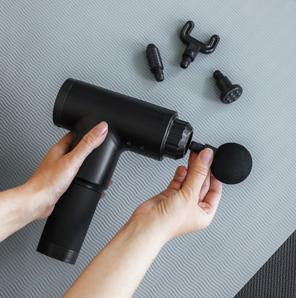 Massagepistol med 4 huvuden
