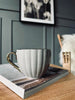 Tekopp med guldhank – Beige